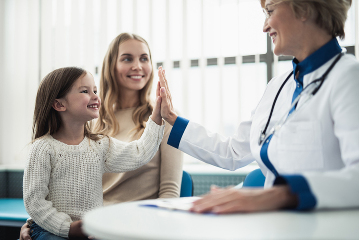Mother and her daughter consulting with doctor